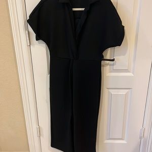 Basic black dress , soft cotton material can be dressed up or down . Worn once
